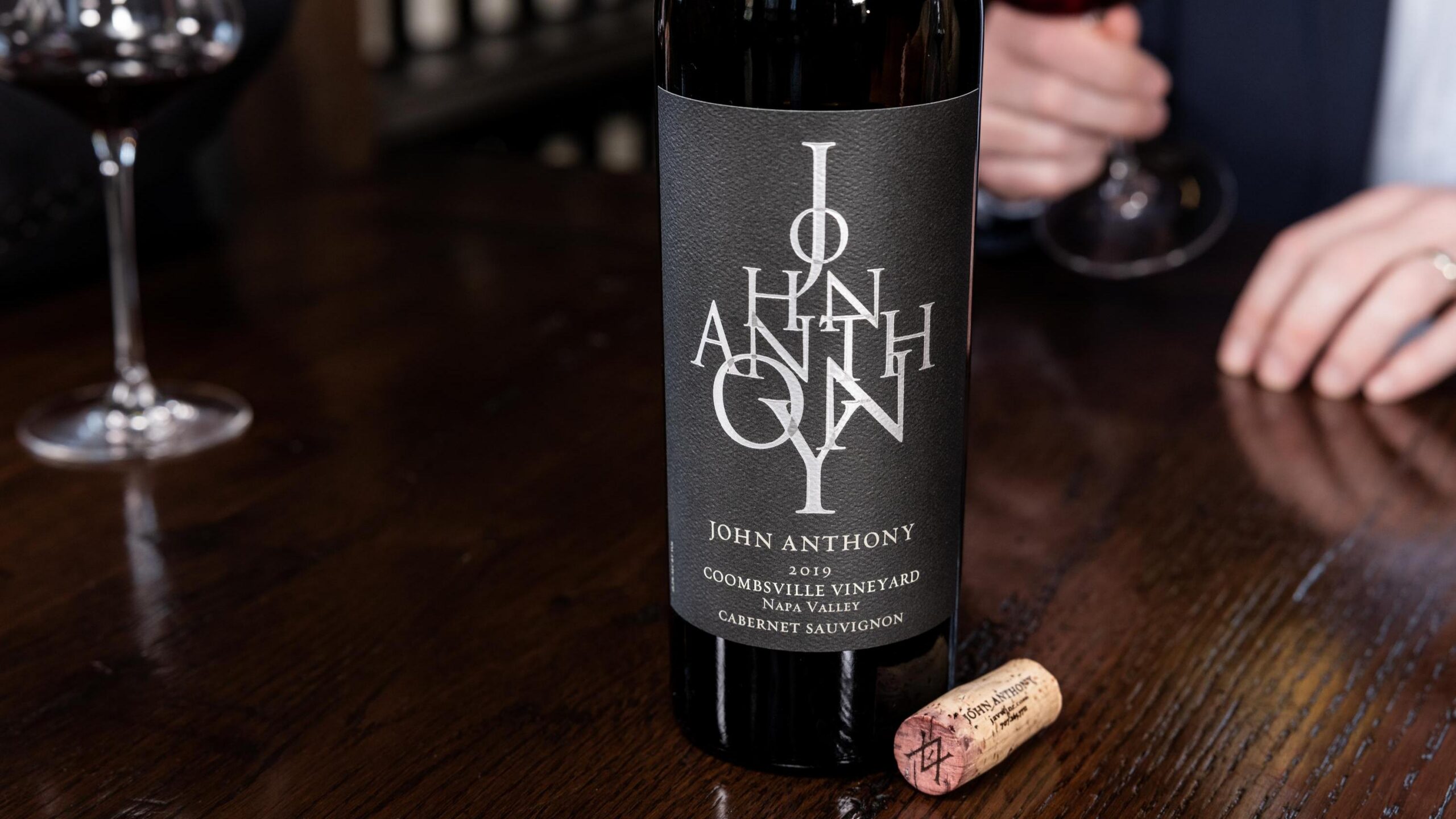 John Anthony Vineyards wine glass and bottle