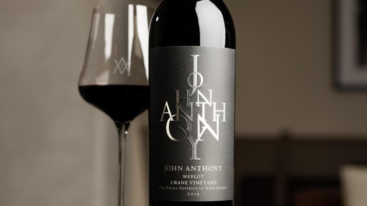 John Anthony Vineyards wine glass and bottle