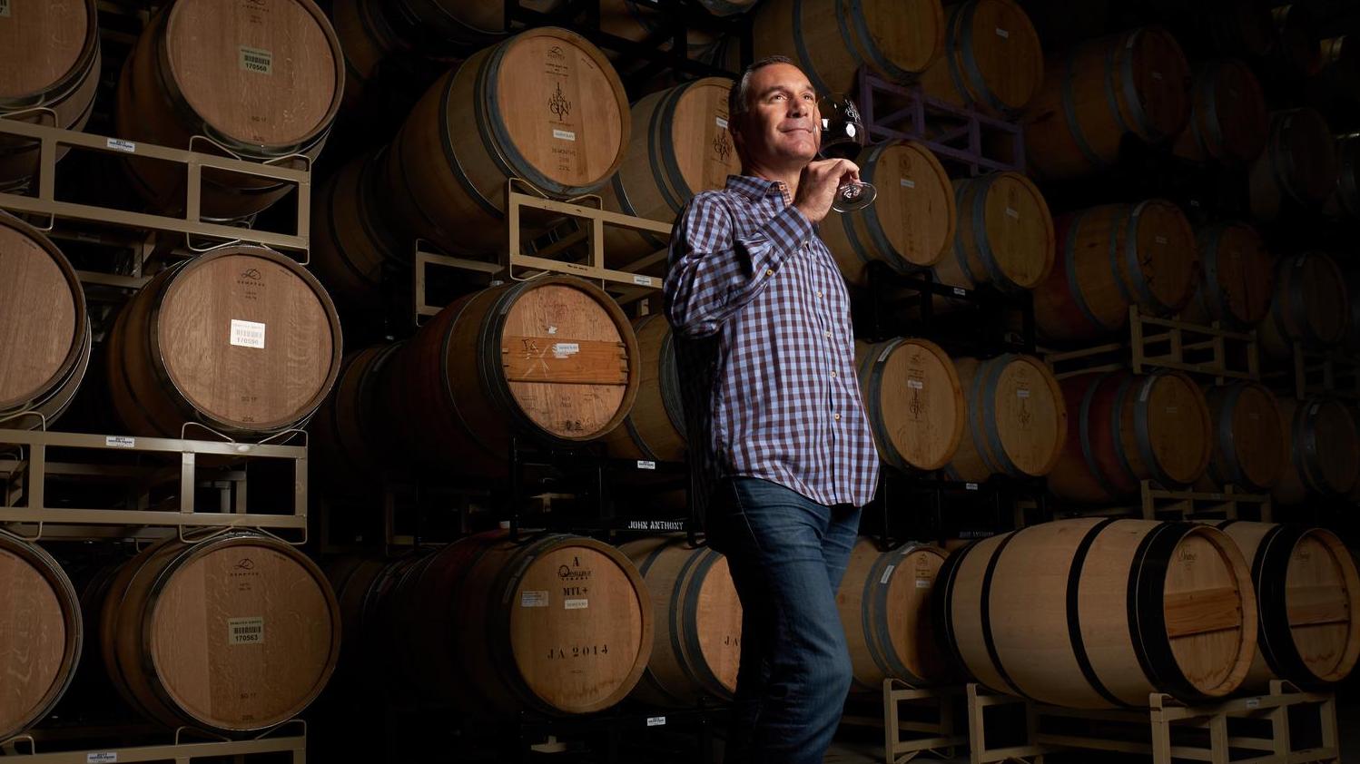John drinking wine
