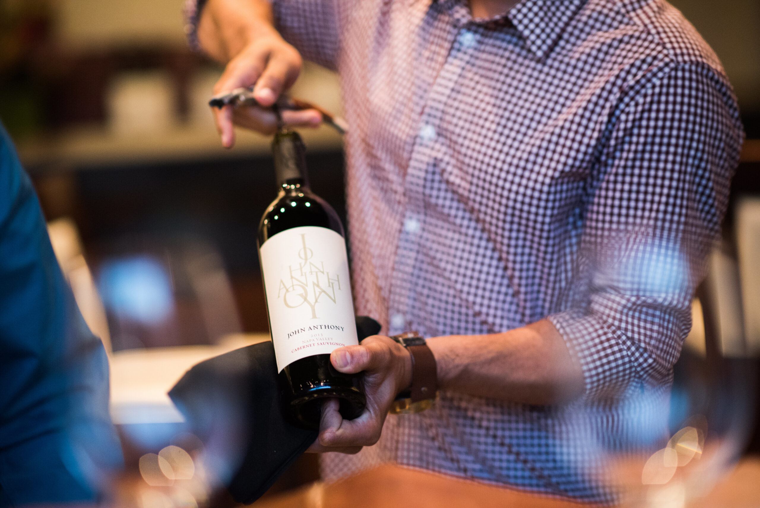 Uncorking a bottle of wine